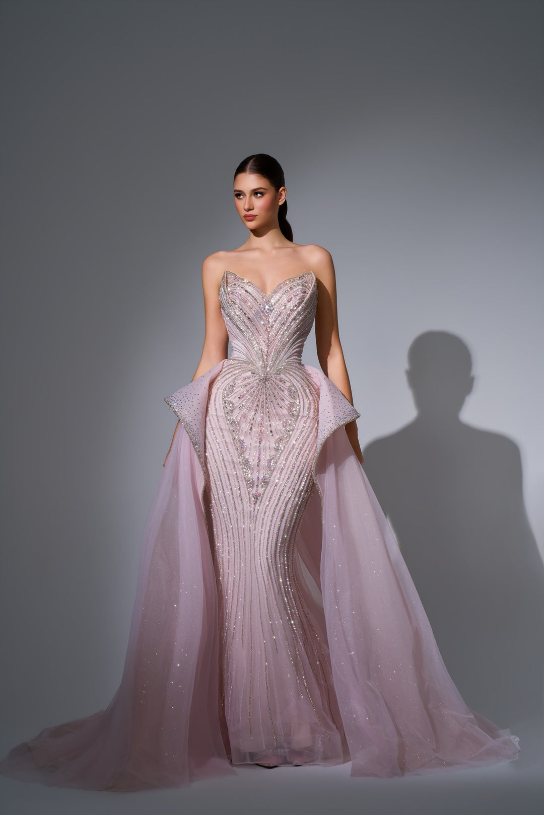 Delilah LD12089 Strapless Plunging Crystal Mermaid Gown with Peplum and Tulle Overskirt - Pink front view