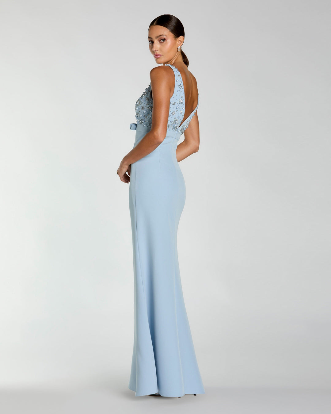 Blue Crepe Sleeveless Beaded V Neck Gown With Bow - FOSTANI.com