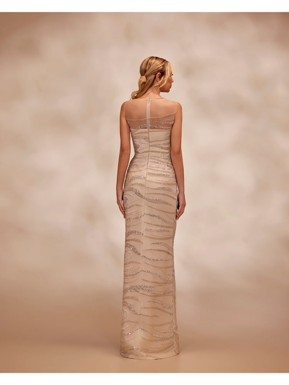 RTW25- Sleevless nude dress adorned with intricate swirling silver sequins - FOSTANI.com